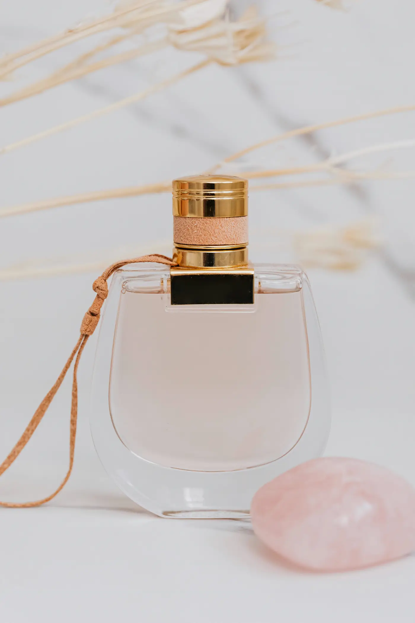 Editorial perfume bottle styling for the fragrance section